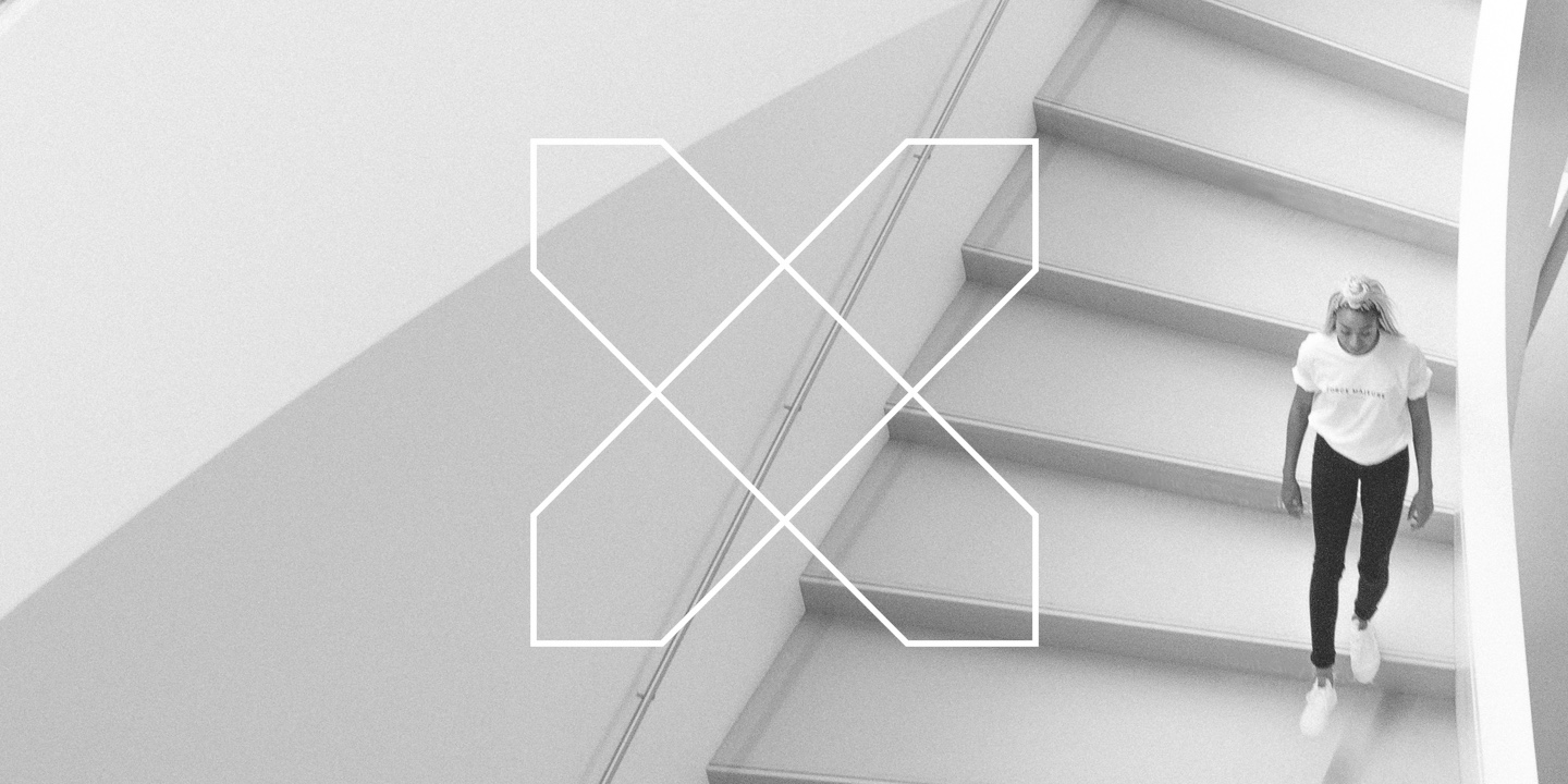Rebranded Simple Xavier Knight logo with a woman walking down stairs