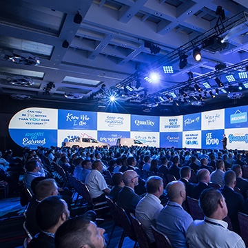 Volkswagen conference with many people sitting in a crowd