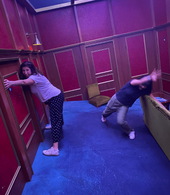 Drou and Chelo hang on in a warped room on our team day out.